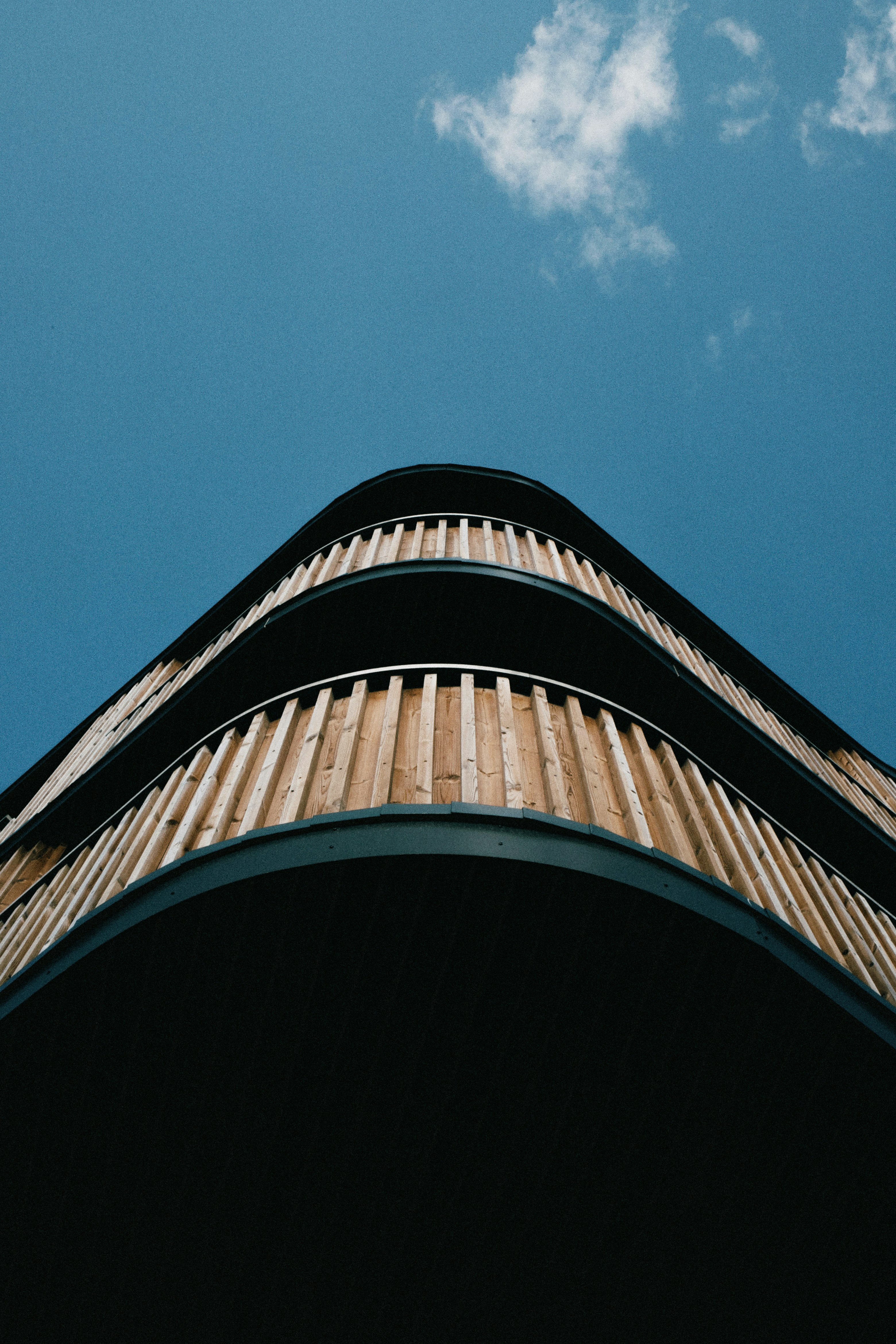 black and white concrete building under blue sky during daytime